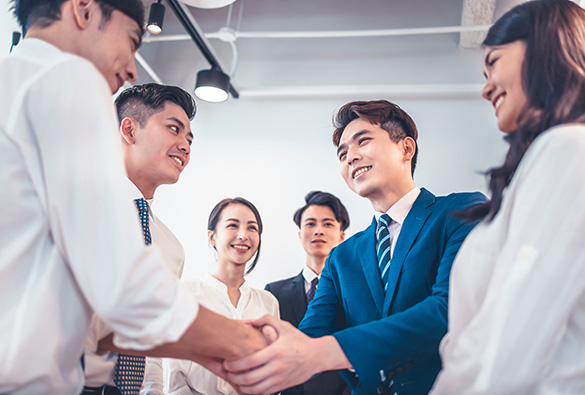  a group of people making a deal