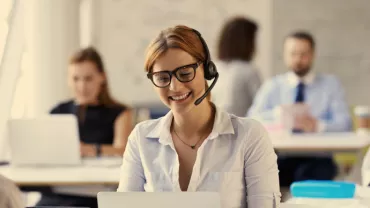 a woman smiling in the office