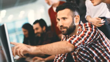 man pointing at the screen